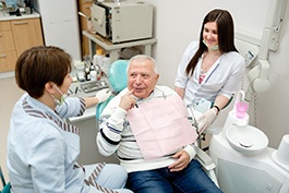 Dentist explaining how dental implants work in Buckhead